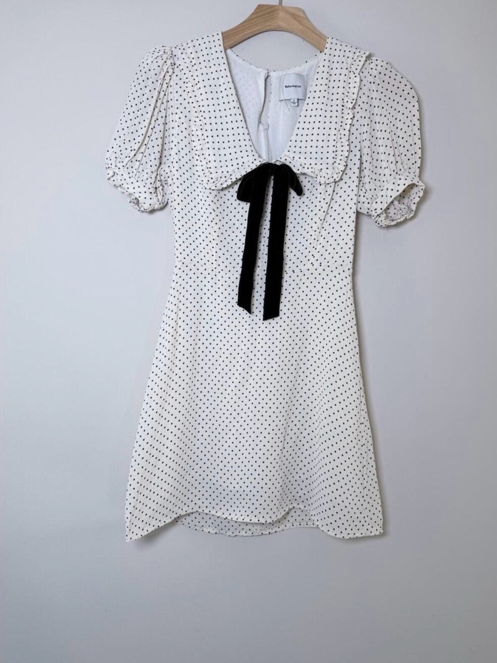 Reformation Kaylia Polka Dot Mini Dress in cream with a black bow - Picture 9 of 9